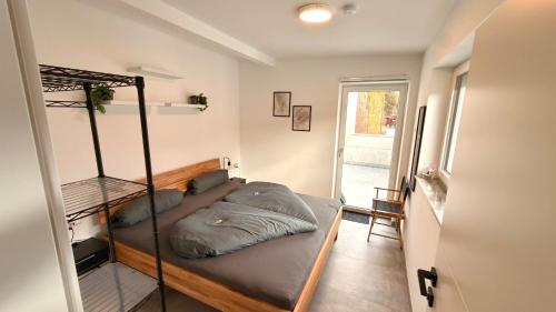 a bedroom with a bunk bed and a window at Apart Schwalbennest in Imst