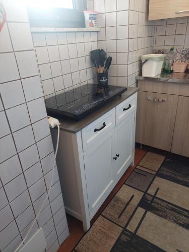 a kitchen with a white counter top in a room at L'Antica Corte in Mongardino