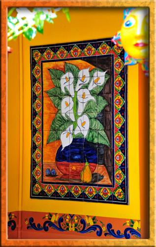 a painting of a blue vase with flowers in it at Blue Seas Courtyard in Fort Lauderdale