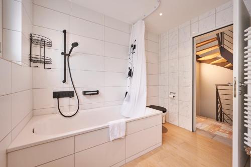 a bathroom with a shower and a bath tub at Chalet in Thun, modern, spacious, perfect location in Thun