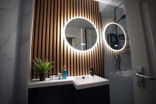 a bathroom with a sink and a mirror at Preston Central in Preston