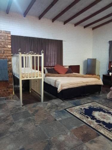 a bedroom with two beds in a room at Mountain Guesthouse in Pretoria