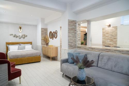 a living room with a couch and a bed at Mediterranean in Preveza