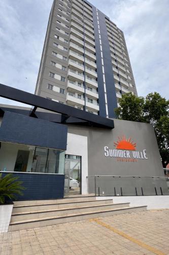 a building with a summer village sign in front of it at Apartamento confortável em Santarém in Santarém