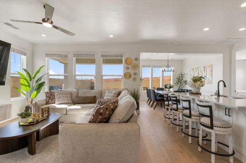 a living room and kitchen with a couch and a table at Splash and Putt Paradise home in Washington