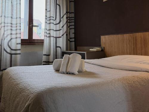 Lova arba lovos apgyvendinimo įstaigoje Hotel Giada