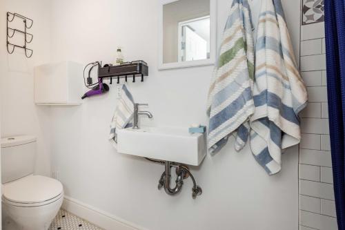 a bathroom with a sink and a toilet at Huh's Lodge in San Francisco