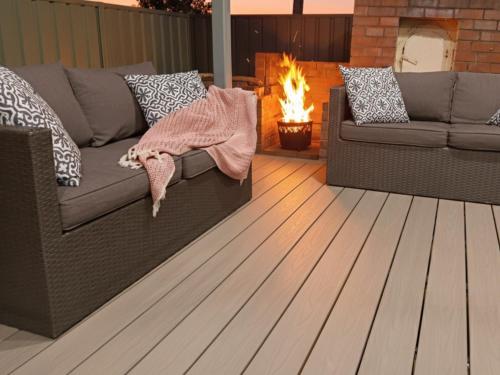 a living room with a couch and a fire place at 100m to Beach&Shop Spacious Pristine One Story Family Home in Batemans Bay