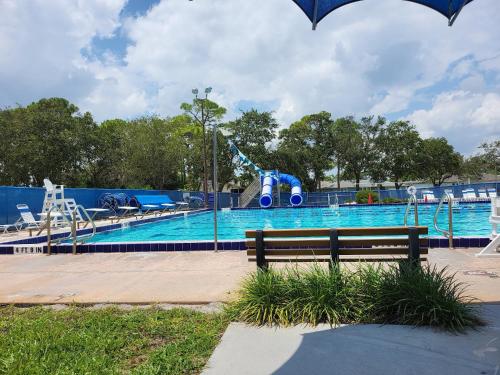 a park with a pool with a water slide at Cypress Retreat Cozy Ft Myers Pet Friendly Home in Fort Myers
