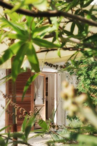 a front door of a house with a window at Le Clair de la Plume - Teritoria in Grignan