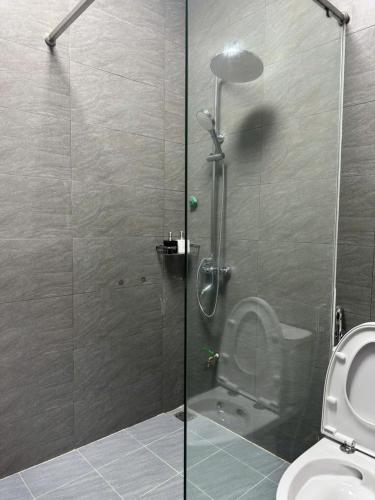 a shower stall with a toilet in a bathroom at Đậu Homestay Phố Cổ in Ninh Binh