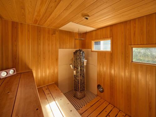 a room with a sauna with wooden walls at Oyado S in Hakone