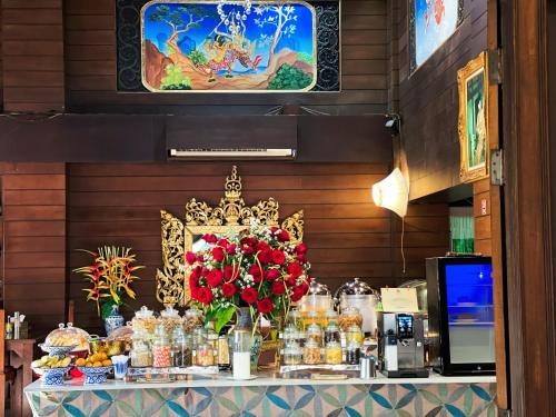 a buffet of food on a table in a restaurant at Singha Montra Lanna Boutique Style Hotel in Chiang Mai