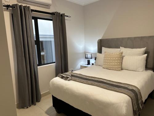 En eller flere senge i et værelse på Moonlight Apartment