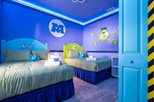 a childs bedroom with two beds and purple walls at Wonderful 5 Bd w Pool @ Storey Lake Resort 2545 in Kissimmee