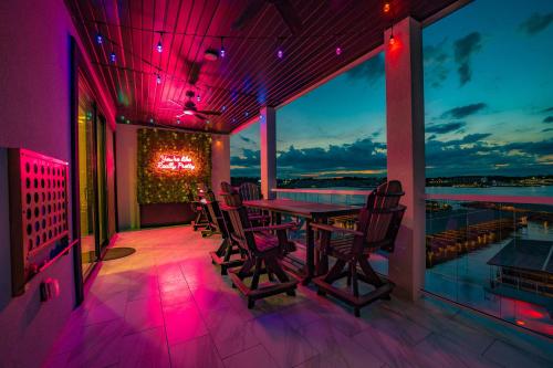 a dining room with a table and chairs on a balcony at Wow Where Dreams become Reality New Luxury Unit in Osage Beach