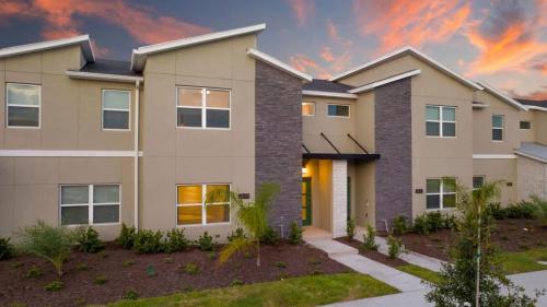 a rendering of a house at sunset at Marvelous 4Bd w Pool Close to Disney at Storey Lake 2629 in Kissimmee
