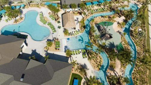 an overhead view of a pool at a resort at Gorgeous 4 Bedroom w Screened Pool Close to Disney 2653 in Kissimmee