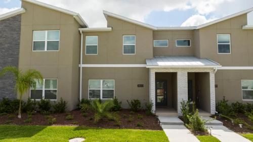 a large house with at Gorgeous 4 Bedroom w Screened Pool Close to Disney 2653 in Kissimmee