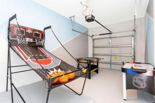 a room with a hammock in a room with a gym at Stunning Family Friendly 5 Bd w/ Pool Close to Disney @ Storey Lake 4242 in Kissimmee