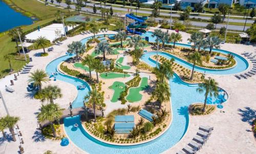 an aerial view of a water park at a resort at Five Bedrooms TownHome with Pool 4849 in Kissimmee