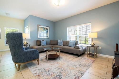 a living room with a couch and a table at Five Bedrooms TownHome with Pool 4849 in Kissimmee