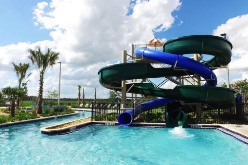 a water slide in a pool at a resort at Four Bedrooms close to Disney w Pool 4898 in Kissimmee