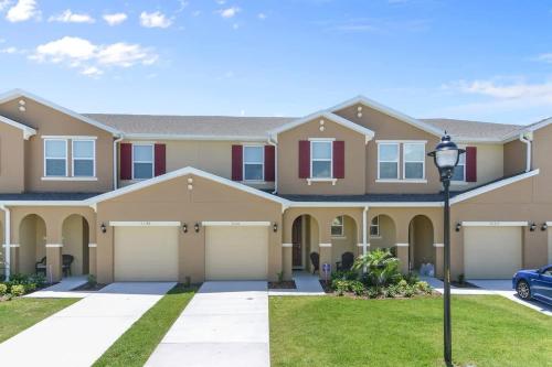 a large house with a garage at Four Bedroom with GameRoom 5150A in Kissimmee