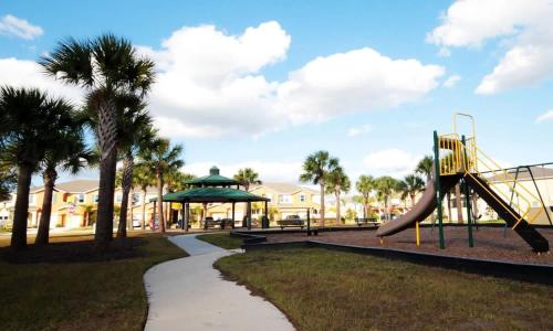 a park with a slide and a playground at Four Bedroom with GameRoom 5150A in Kissimmee