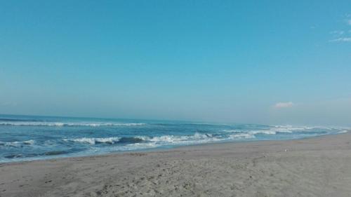 a sandy beach with the ocean in the background at QUINTA DIAMANTE villas&hotel in Barra Vieja
