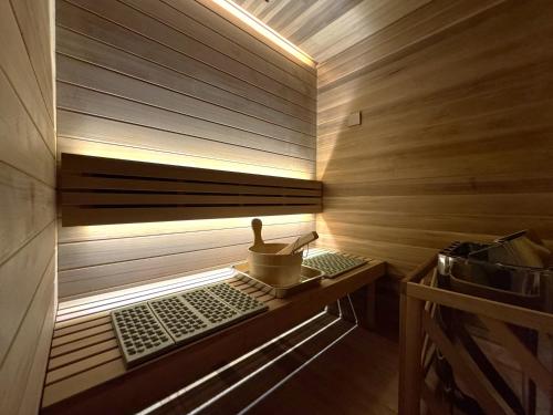 a wooden sauna with a duckling sitting on a shelf at Aoniwa Awaji - Sea, Sky, Swing in Awaji