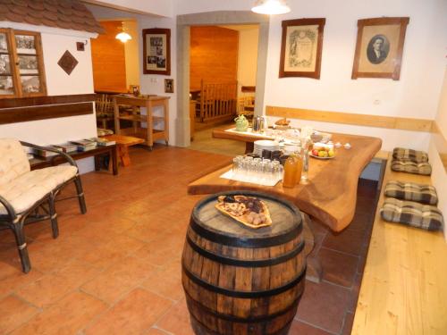 a large room with a table and a barrel at Glamping Organic Farm Slibar in Tržič