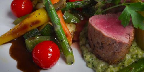 a plate of food with meat and vegetables on it at Landhotel Windlicht in Krombach