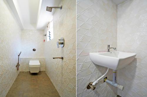 a bathroom with a sink and a toilet at Super Hotel O Sunshine Villa in Nagpur