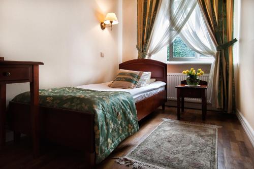 Posteľ alebo postele v izbe v ubytovaní Aparthotel Karmel