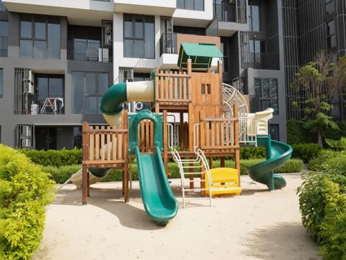 a playground in front of a apartment building at Laguna SkyPark new brand apartments in Phuket