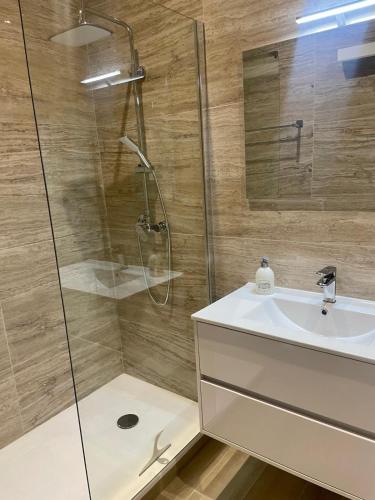 a bathroom with a shower and a sink at Chez Jo Fayence in Fayence
