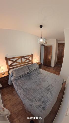 a bedroom with a large bed in a room at El Bosque Nomada 4 in El Bosque