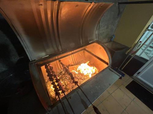 a large oven with a fire in it at Quinta Paraiso in Funchal