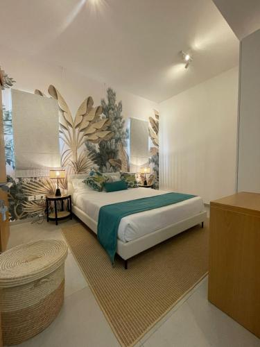 a bedroom with a large bed in a room at Ki Resort Apartments & Penthouses by LOV Mauritius in Grand-Baie