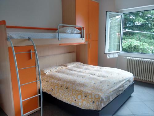 a bedroom with two bunk beds and a ladder at Gardens House in Varenna