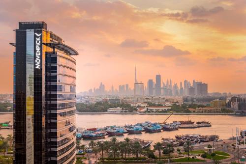 a view of a city skyline with a tall building at Mövenpick Dubai Creek in Dubai