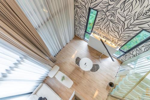 an overhead view of a living room with a glass floor at Heaven Sukhumvit 62Villa in Bangkok