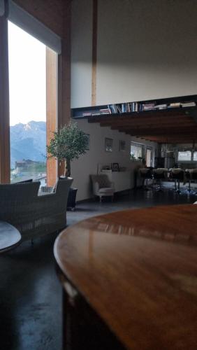 a living room with a couch and a table at Charming 6 bed chalet in 4 Valleés in Iserables