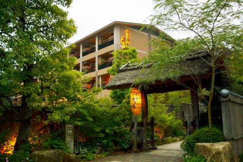 a building with a sign on the side of it at Setsugetsuka in Hakone