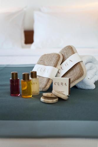 a group of towels and oils on a table at Hotel Cura in Canakkale