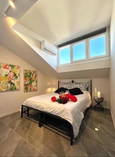 a bedroom with a large bed with flowers on it at Casa Carletti in Chivasso