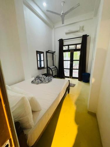 a bedroom with a large bed in a room at Janaka Villa - Ahangama in Ahangama