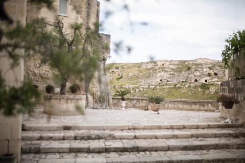 a group of stairs in front of a building at Sant'Angelo, Matera - Small Luxury Hotels in Matera