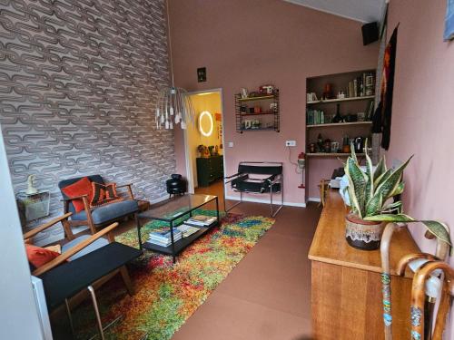 a living room with a couch and a table at appartement Kemperberg in Arnhem